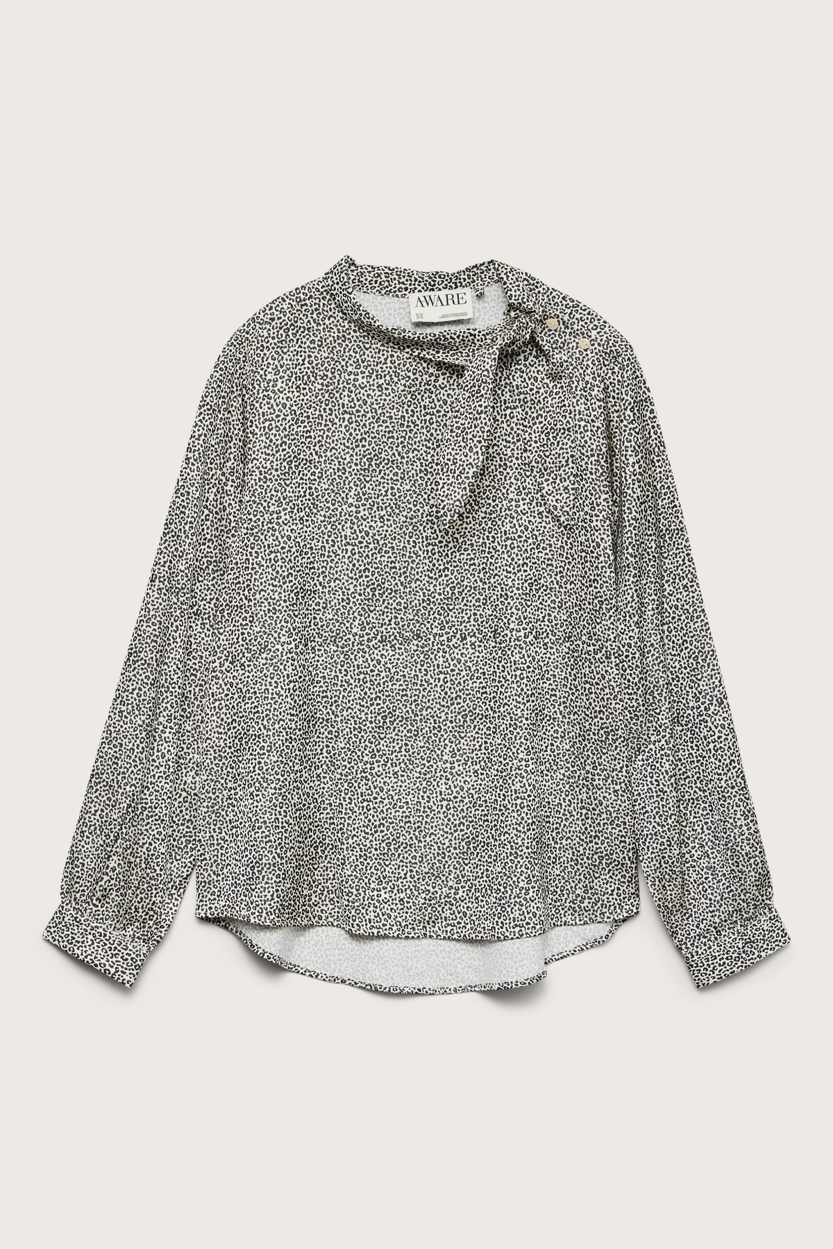 Animal print blouse with a tie neckline on a light gray background
