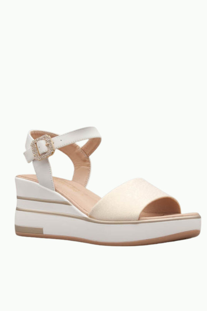 White sandal with a platform sole on a white background
