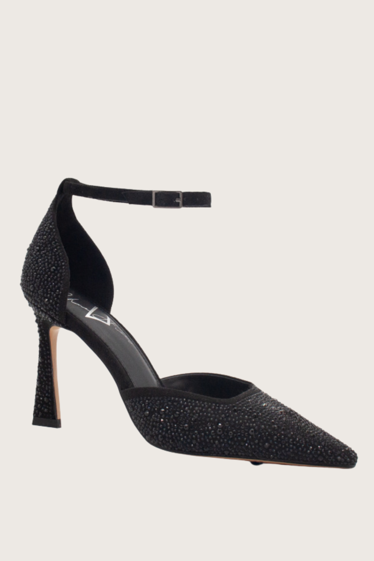Black high-heeled shoe with sparkling details on a light gray background