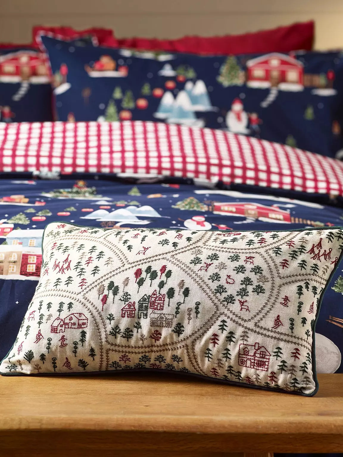 CATHERINE LANSFIELD Christmas Ski Village Embroidered Cushion- 30x50cm